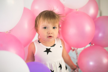 Fototapeta na wymiar Crazy Toddler with balloons, children's holiday