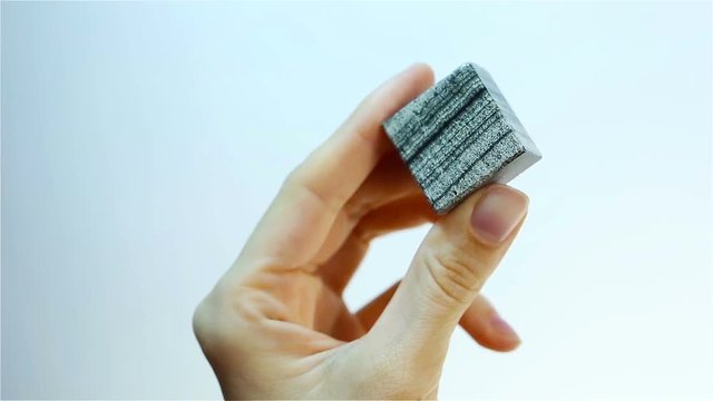 Skarn &ndash; Skarns or tactites are calcium-bearing calc&ndash;silicate rocks. Jeweler holding Skarn mineral