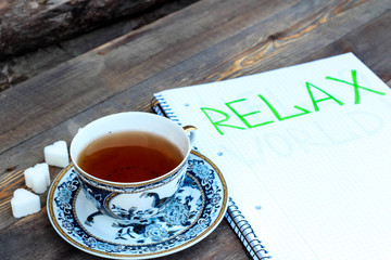 Porcelain cup of tea on a wooden background