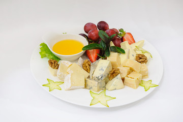 Assorted cheeses on white plate