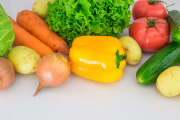 Group of vegetables closeup view. Carrots, tomatoes,cucumber. Bell pepper, onion, potatoes