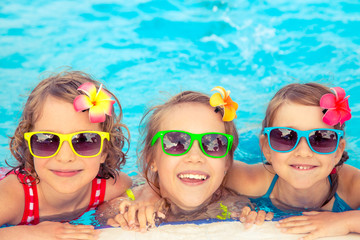 Happy children in the swimming pool