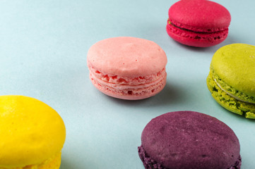 Colourful french macaroons on the grey background