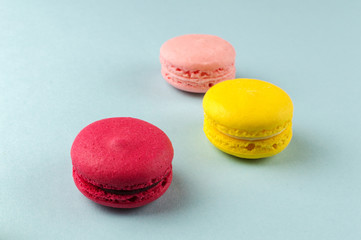 Colourful french macaroons on the grey background
