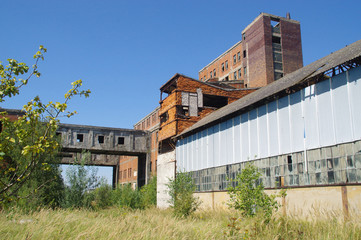 Fototapeta na wymiar Overgrown ruins of old factory