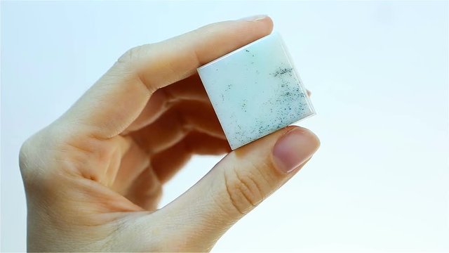 Chrysoprase &ndash; is a variety of chalcedony quartz. Jeweler holding Chrysoprase