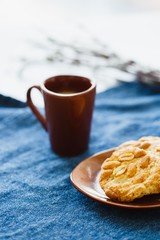 A cup of espresso on a table with cookies