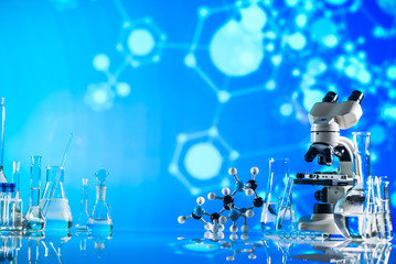 Science laboratory research and development concept. microscope with test tubes