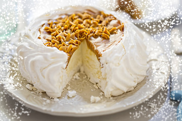 Christmas Toffee Pavlova with caramel shavings and snow 