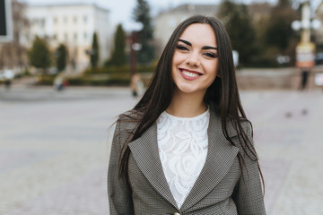 Portrait of business woman on the street.