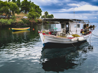 Traditional fishing boat in the aegean sea, Greece. Neos Marmaras. Halkidiki.