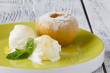 Vanilla ice cream served with backed apple