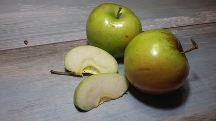 Apple on a blue background. Apple cut, apple slice