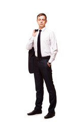 Young handsome businessman is holding a jacket in his one hand and the other hand in his pocket. portrait isolated on white background