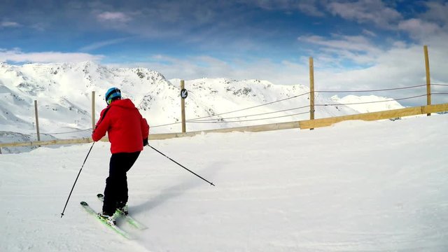 Man skiing on the prepared slope with fresh new powder snow in Tyrolian Alps, Zillertal, Austria 