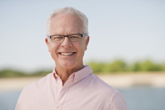 Senior man wearing glasses outdoors