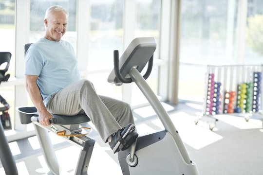 Senior man on static bike
