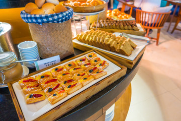 Assortment of fresh pastry on table in buffet .