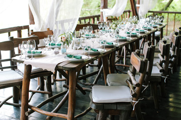 festive table setting in classic style, setout.. Wedding table decor. Table layout. Restaurant interior. Fine art. expectation of guests.