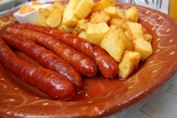 Serbian sausage and potatoes in a dish
