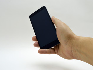 black smartphone in hand