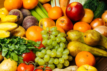 Different fresh raw vegetables and fruits background
