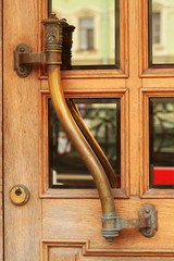 the wooden handle on the door.