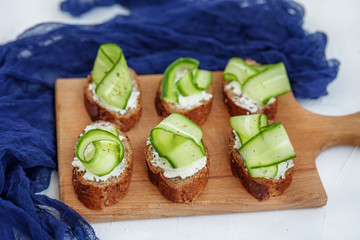 Sandwiches with cheese feta and cucumber. The concept of food and vegetarianism.