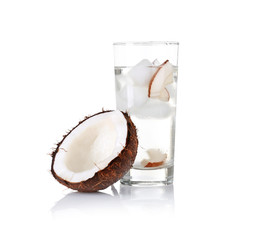 Glass of coconut water and fresh nut on white background © Africa Studio