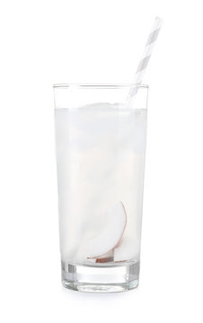 Glass of coconut water on white background