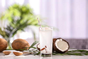 Glass of coconut water on table