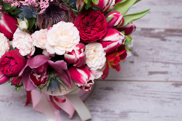 beautiful floral arrangement in a hat box