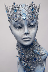 Mannequin in creative silver crown and collar