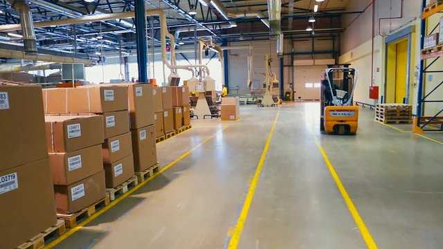 Aerial Footage Forklift Trucks Loads In The Rack Inside warehouse