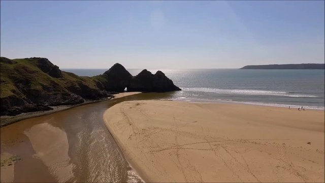 The stream that runs through Three Cliffs Bay at low tide, Gower, Swansea