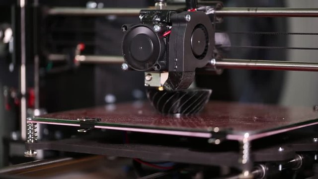 3d printer prints a black 3d model. The video is shot close-up. This video was shot using Canon 5d Mark 3. If you liked this video, rate it, please!