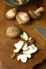 Shiitake mushrooms on a wooden table. Selective focus