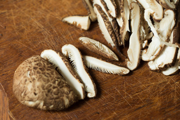 Shiitake mushrooms on a wooden table. Selective focus
