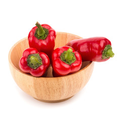 red chilli vegetable in Wooden bowl Isolated on white background
