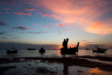 Fototapeta premium father and son walking and play at the beach sunset background