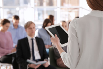 Business trainer giving presentation to group of people © Africa Studio