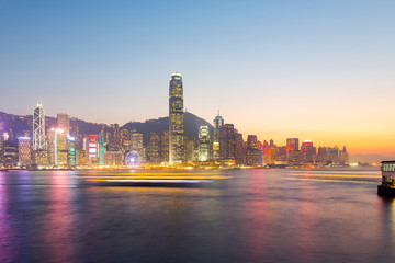 Cityscape and skyline at victoria harbour in hong kong city at twilight time.