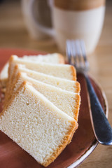 slices of sponge cake with tea - 143736941