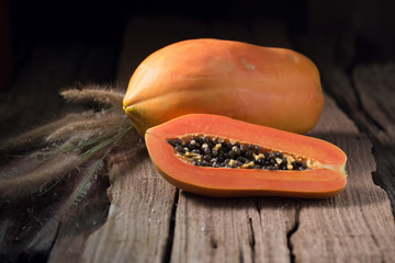 Papaya on wooden background. Sliced of papaya.