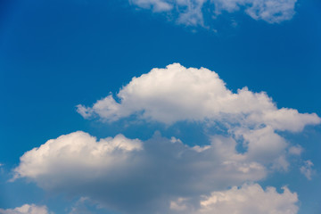 Obraz na płótnie Canvas white fluffy clouds in the blue sky.