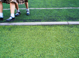 Obraz premium Children in the artificial turf of the school