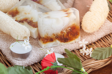 Natural spa beauty treatment products on tower in wicker basket