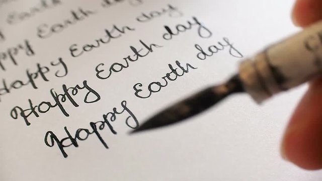 Happy earth day calligraphy and lattering. Eighth line. Close-up whith audio