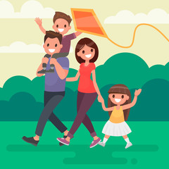 Happy family walks outdoors and launches a kite. Vector illustration in a flat style