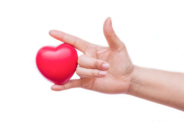 Obraz premium hand holding a red heart on white background